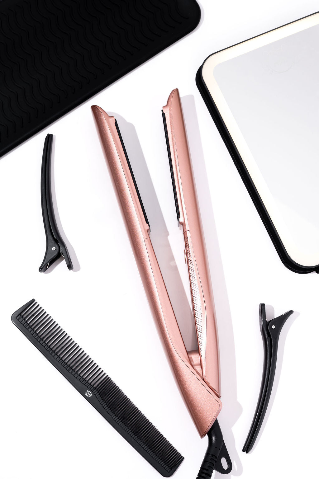 H2D Opulence Rose Gold hair straightener, open, with comb and sectioning clips
