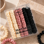 Silky Satin Scrunchies 6 pack styled on a stone surface