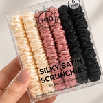 Hand holding the Silky Satin Scrunchies 6 pack