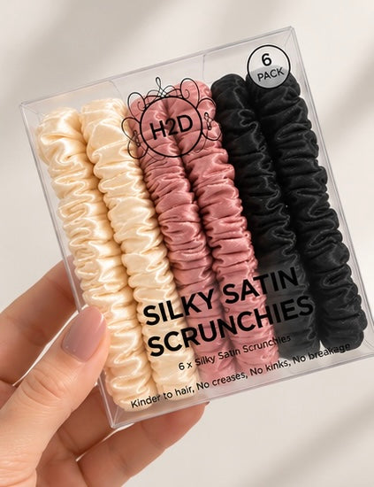 Hand holding the Silky Satin Scrunchies 6 pack